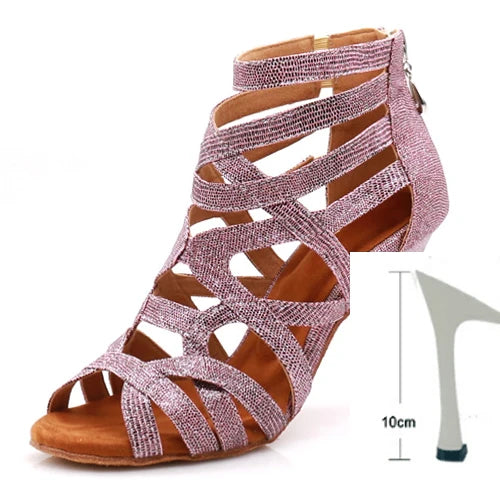 A single women's strappy high-heeled sandal with a sparkling metallic pink upper and a brown footbed, shown on a white background with a small heel-height diagram labeled 10cm.