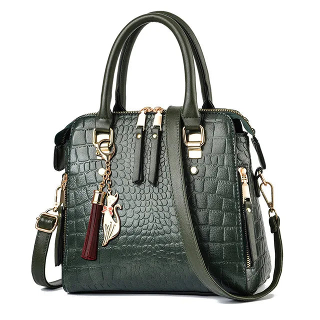 Green textured handbag with gold accents and a tassel on a white background