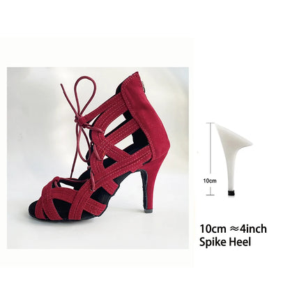 A red suede-look high-heeled sandal with cutout straps and ankle ties, shown on a white background with a small inset diagram indicating a 10 cm spike heel.