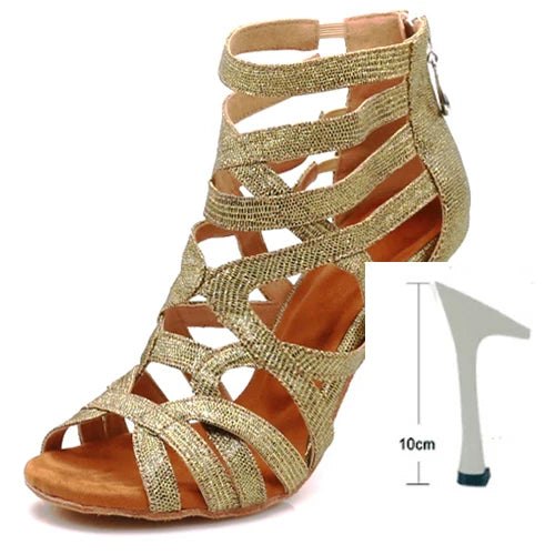 A single metallic gold strappy sandal with a low block heel, shown on a white background with a small heel-height measurement inset indicating 10cm.