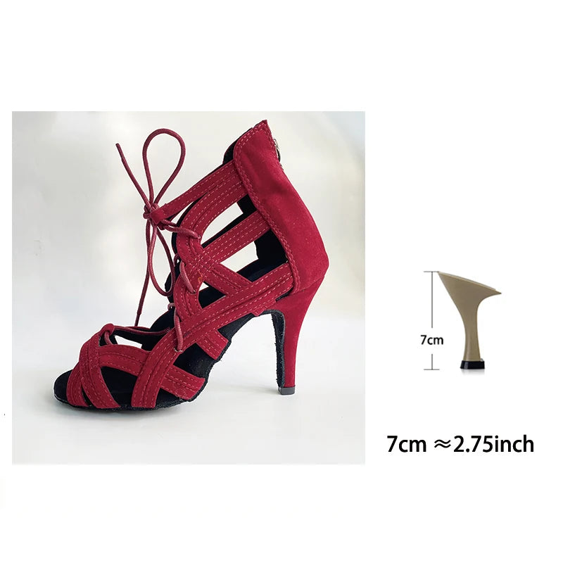 A red strappy high-heeled sandal with lace-up ankle detail, shown on a white background with a small inset diagram indicating a 7 cm heel height.