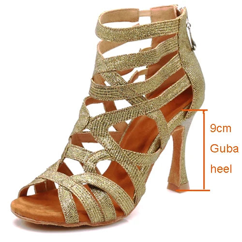 A single metallic gold glitter high-heeled sandal with an ankle strap and cutout straps, shown on a white background with an orange dimension overlay indicating a 9cm heel.