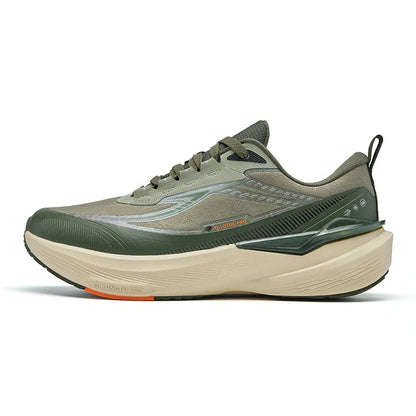 A QIAODAN athletic sneaker shown in a side profile view on a white background. The shoe features a textured olive green and gray upper, a thick beige midsole, and a small orange accent on the outsole.