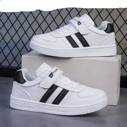 White sneakers with black stripes on a gray surface, featuring the NBGAGA brand.