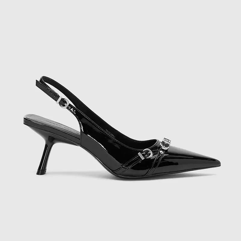 Black patent leather slingback shoe on a light gray background