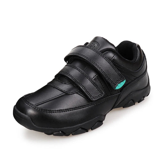 A black low-top casual shoe with two hook-and-loop straps, a small mint green accent on the side, and a rugged sole, shown on a white background with the UOVO brand logo in the top-left corner.