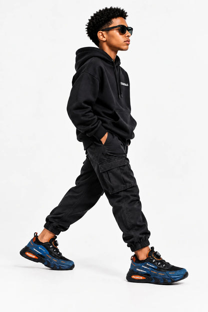Black and blue sneakers with orange accents on a white background