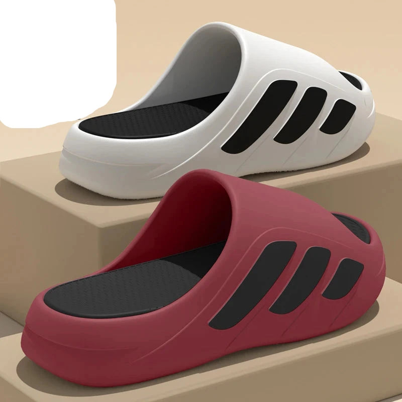 White and red slides with black soles on a beige background, featuring EVA material label.