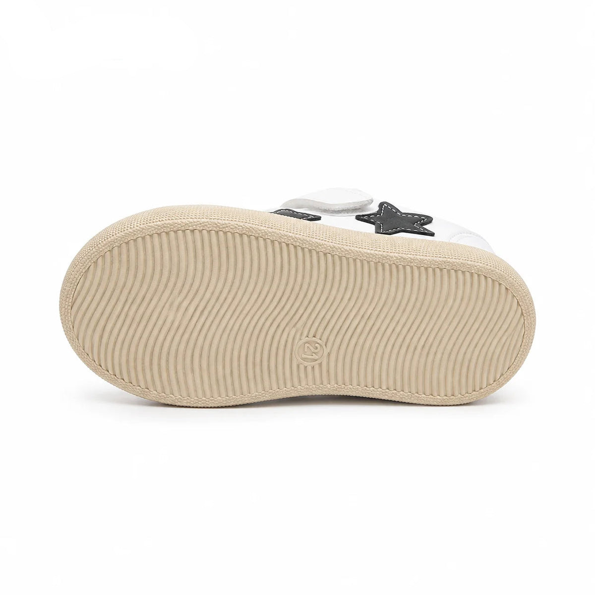 A close-up of a shoe's beige sole with a wavy tread pattern, showing a white upper with a black star detail, on a white background with the PmwRun logo in the top left.