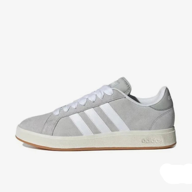 Gray Adidas sneaker with white stripes on a white background