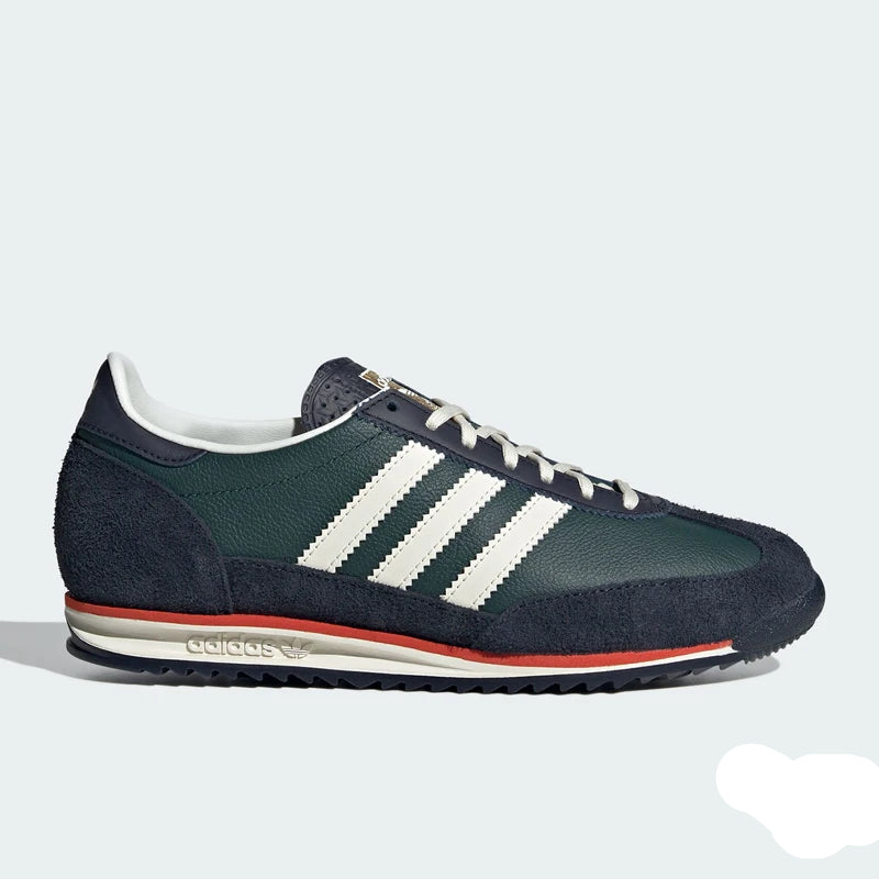Green Adidas sneaker with white stripes on a light gray background
