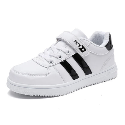A white kids' low-top sneaker with black side stripes, a hook-and-loop strap closure, and a black heel accent, shown on a plain white background.