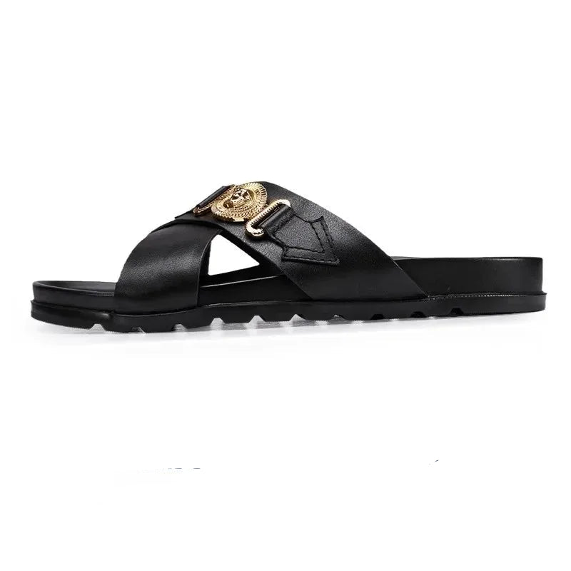 Black sandal with gold buckle on a white background