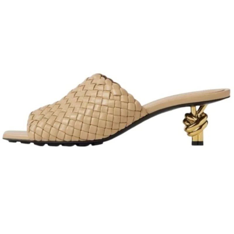 Beige woven sandal with a knotted heel on a white background