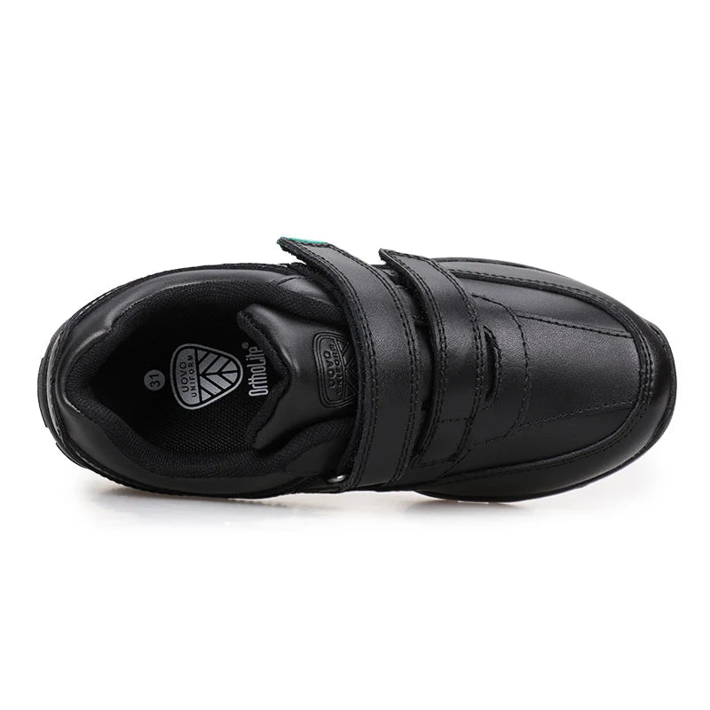 A black UOVO brand children's low-top sneaker with a hook-and-loop strap closure, shown from a side profile view on a white background.