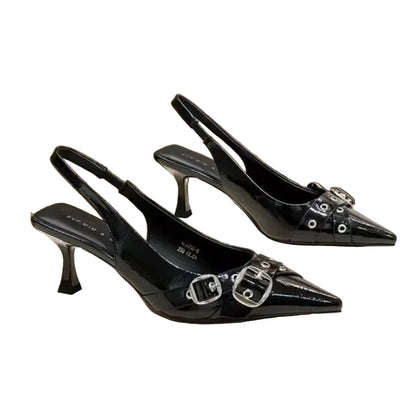 Black high-heeled shoes with buckles on a white surface