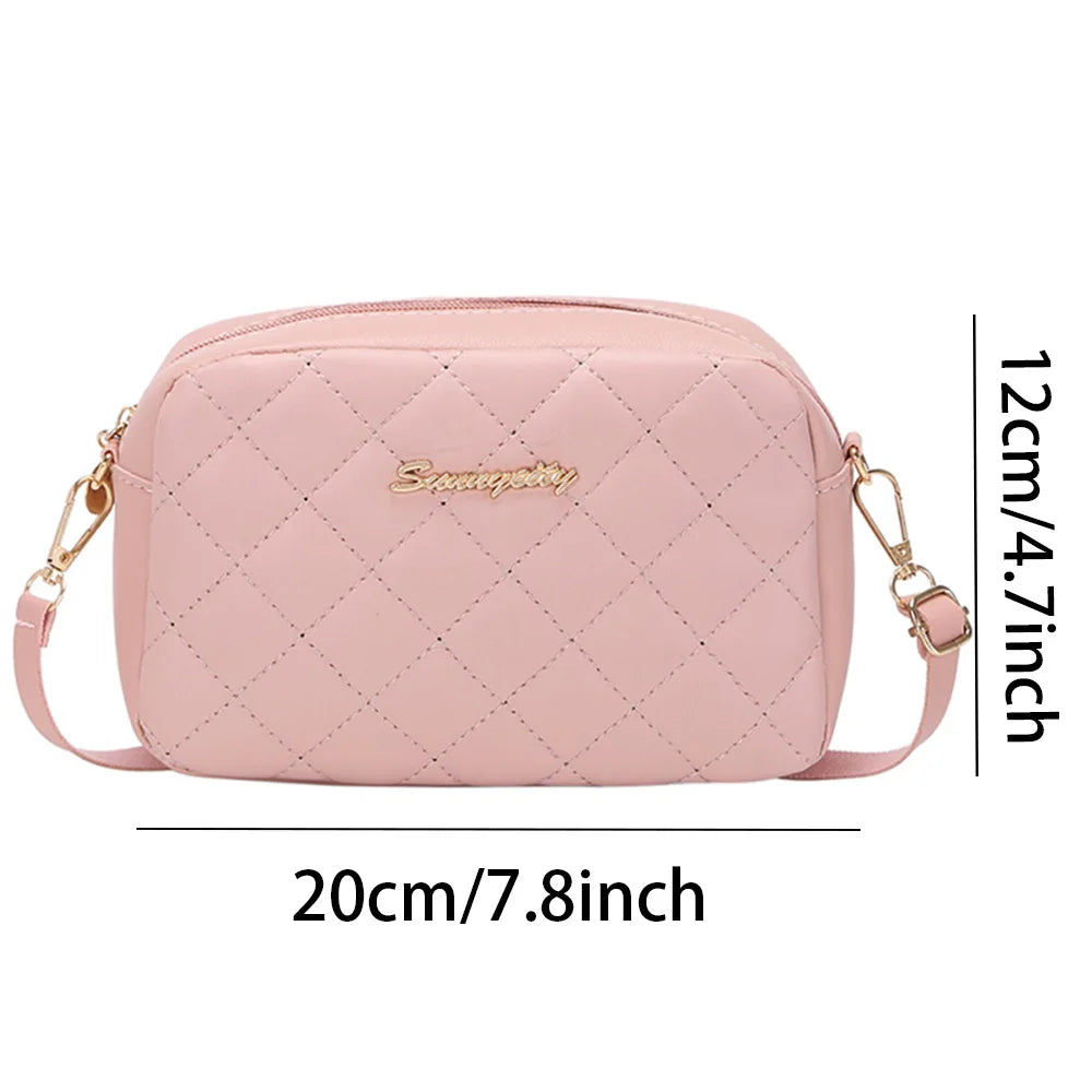 Pink quilted handbag with measurements on a white background