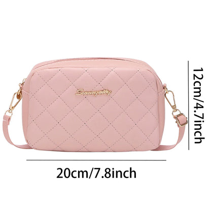 Pink quilted handbag with measurements on a white background