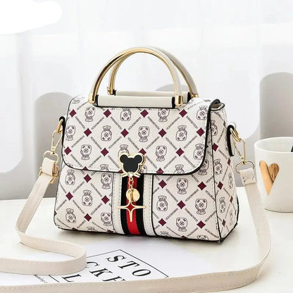 Designer handbag with brand logo on a white background
