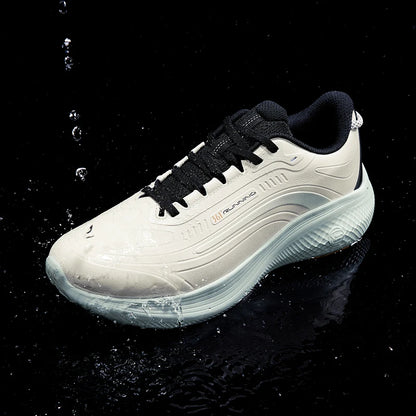 A single athletic sneaker shown at an angle on a glossy black surface with water droplets splashing around it. The shoe is predominantly off-white/cream with black laces, black collar lining, and a small orange brand mark on the side.