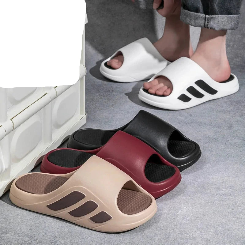 Four slides in different colors on a gray floor with text indicating 'EVA' and 'soft comfortable'.