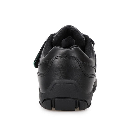 A black leather low-top sneaker shown from a rear three-quarter angle on a white background, featuring a hook-and-loop strap closure with a small green accent tab and a chunky black sole. The brand name 'UOVO' is displayed in the top left corner.