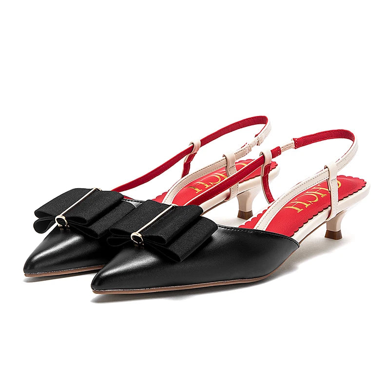 Black and red slingback shoes on a white background