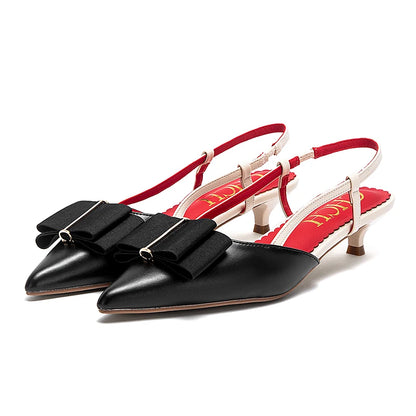 Black and red slingback shoes on a white background