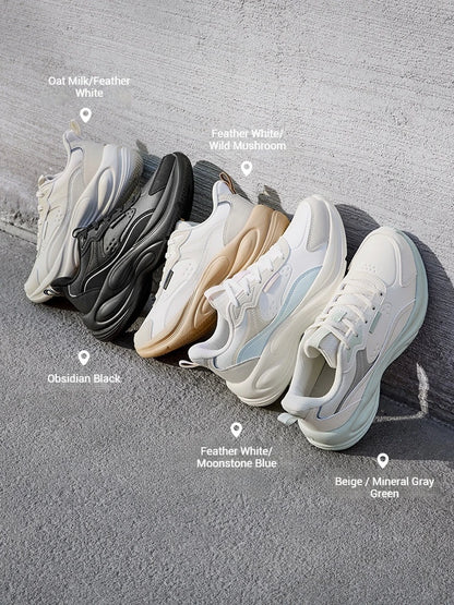 Five chunky platform sneakers arranged diagonally on a gray concrete surface, each labeled with its color variant including oat milk/feather white, feather white/wild mushroom, obsidian black, beige/moonstone blue, and beige/mineral gray green.